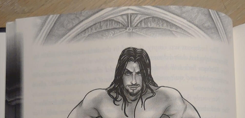 Photo showcasing internal art and top page frame. The art shows a partial Lord Deminas, topless, staring intently at the viewer.